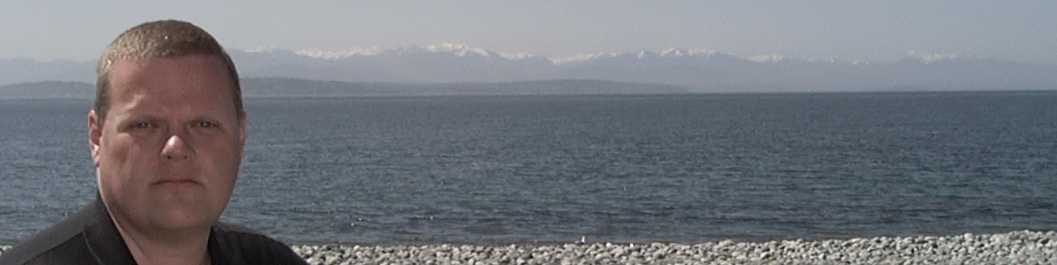 An OK picture of myself with the Olympic 
Peninsula in the background, circa 2002.  Click for current 300dpi close-up of Scot (195kB).
